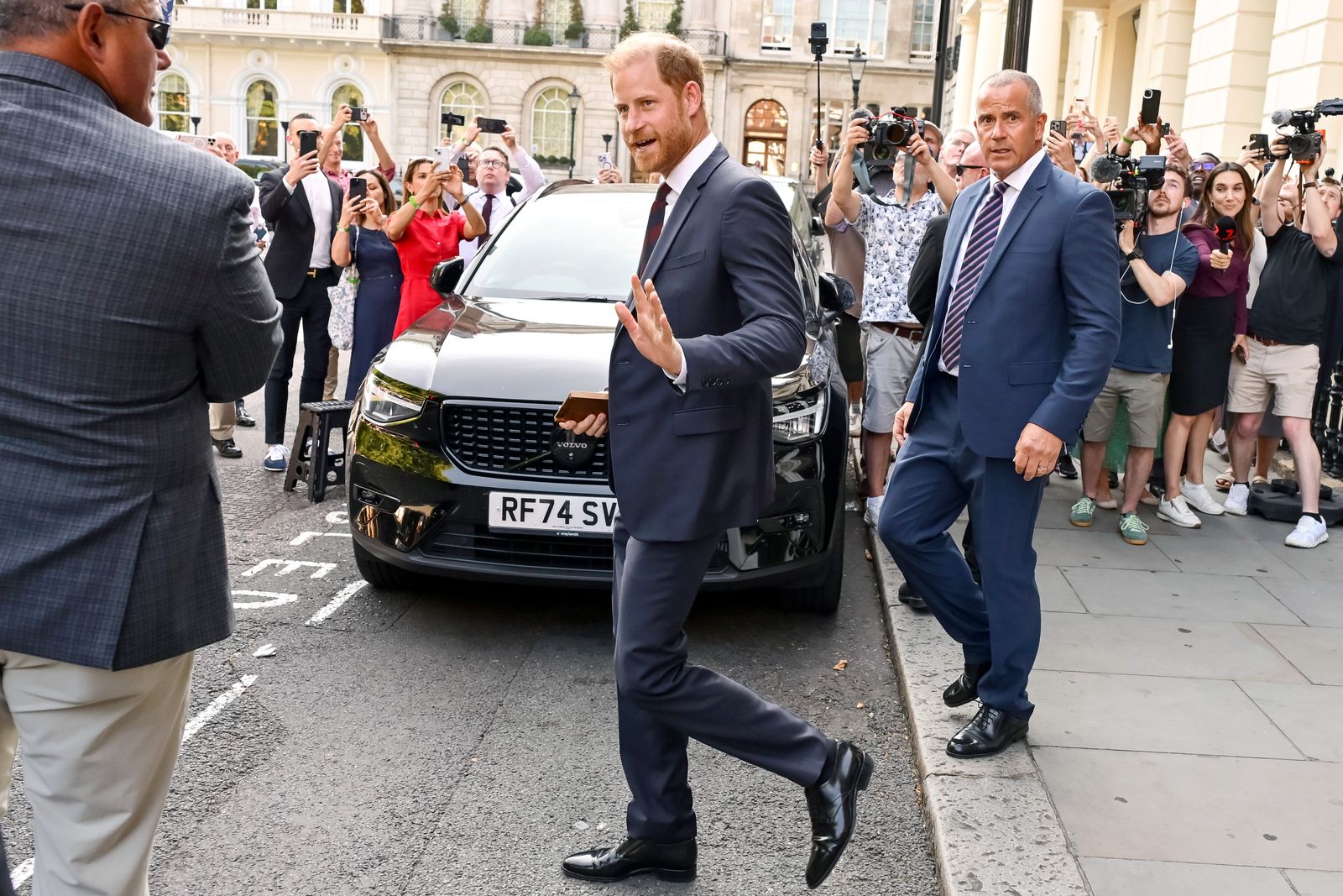 Image may contain Prince Harry Duke of Sussex Jesper Bodilsen Clothing Formal Wear Suit Adult Person and Accessories