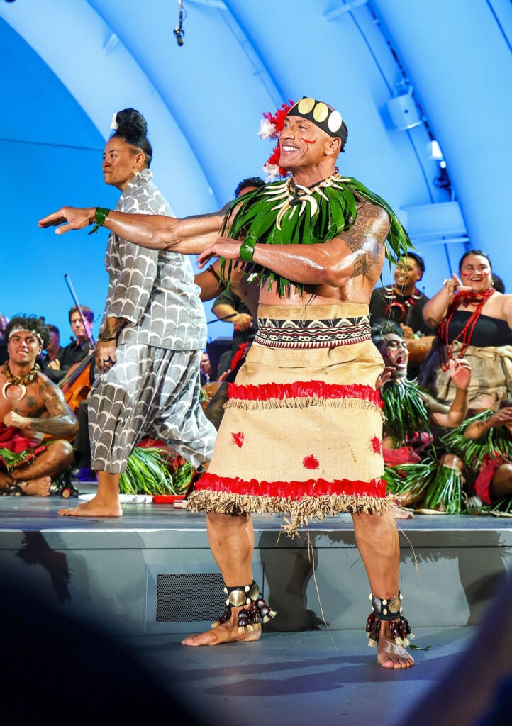 Tiana Nonosina Liufau and Dwayne Johnson perform onstage during the Moana World Premiere 
