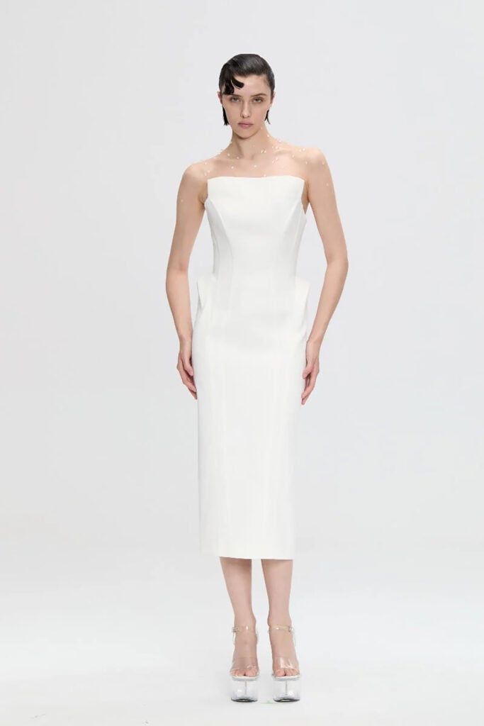 NUÉ Allegra white sculptural dress on the runway.