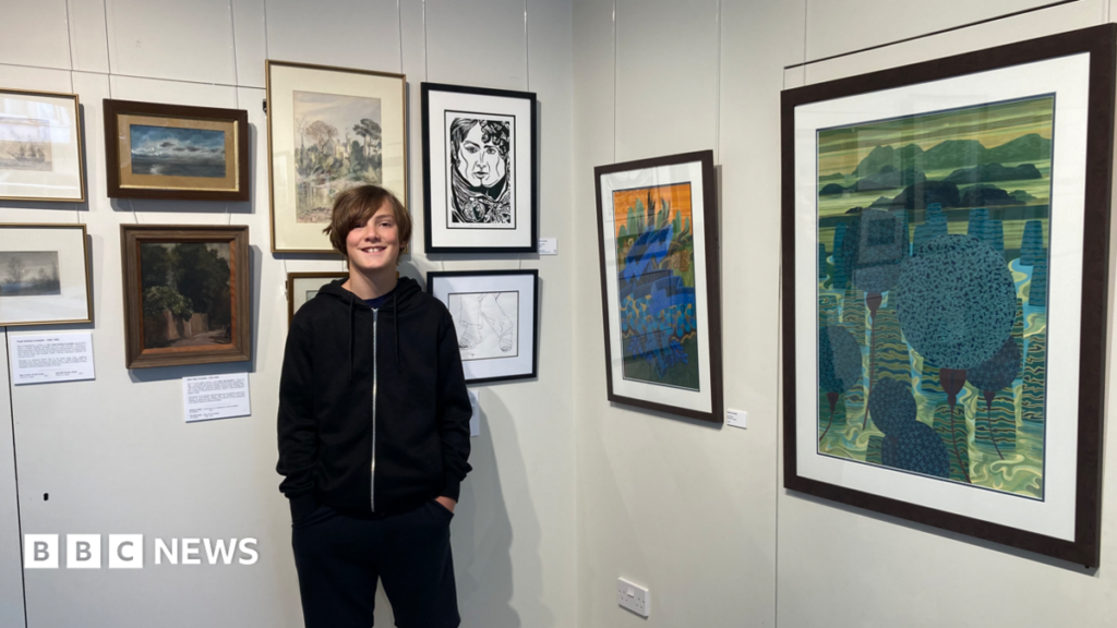 John Constable descendants feature in Dorset family exhibition Valya Constable smiles for the camera next to his framed artwork in the exhibition