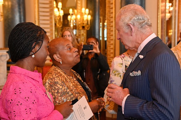 Prince Charles, Prince of Wales, speaks to TV presenter Diane Louise Jordan and Baroness Doreen Lawrence at a reception at Buckingham Palace in London to celebrate the Commonwealth Diaspora of the United Kingdom ahead of the Commonwealth Heads of Government Meeting in Rwanda on June 9, 2022 in London