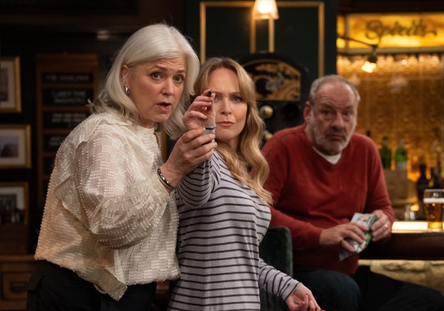 Vanessa and Todd play darts together in Emmerdale