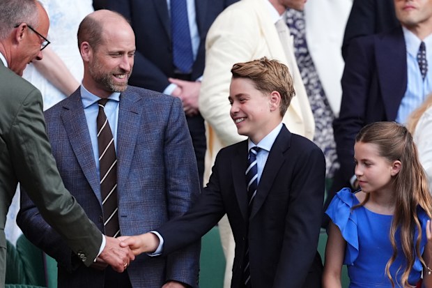 German Chancellor Friedrich Merz, left, greets Prince William, Prince George and Princess Charlotte at the 2026 Wimbledon Tennis Championships at the All England Lawn Tennis and Croquet Club on July 12, 2026 in London, England.
