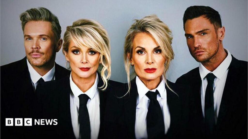 The Fizz set for gig in Cheryl Baker’s Kent garden The four members of The Fizz wearing black jackets and ties and white shirts