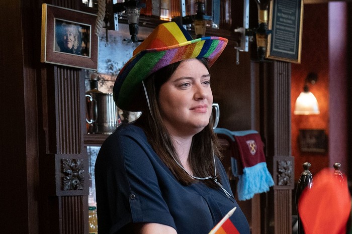 566250,TITLE:Eastenders Zoe Slater wearing a multi-coloured cowboy hat for Walford Pride in a scene from EastEnders
