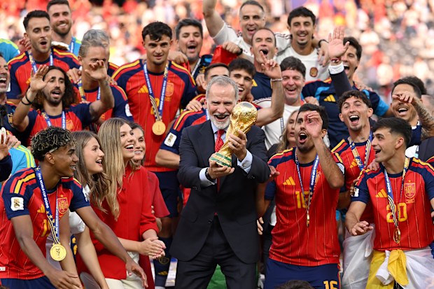 King Felipe VI of Spain lifts the FIFA World Cup Winner’s Trophy while Queen Letizia of Spain, Princess Leonor of Spain and Princess Sofia of Spain and players of Spain watch at the award ceremony following the FIFA World Cup 2026 Final match between Spain and Argentina at New York New Jersey Stadium on July 19, 2026 in East Rutherford, New Jersey.