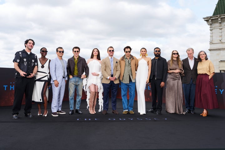 Christopher Nolan posing with the cast of The Odyssey