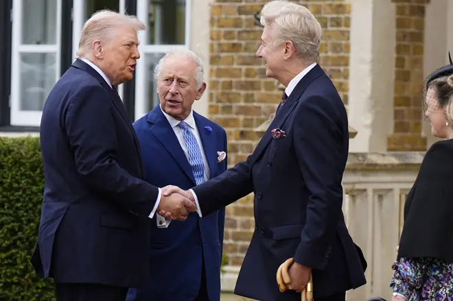 Britain's King Charles III, center, looks on as President Donald Trump meets Sir Clive Alderton, right, at Windsor Castle