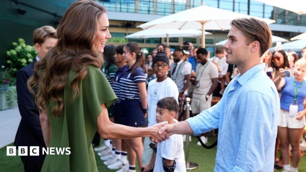 Wimbledon semi-finalist Arthur Fery invites Prince George and Princess Charlotte to play tennis Amelia Lord is a white woman in her late 20s. She has shoulder length brown hair partly pulled back in a ponytail with frontpieces either side of her face. She has defined eyebrows and is wearing makeup, has a central nose ring and earrings, and is smiling at the camera. She wears a sleeveless black top. She is holding a pair of books and stands in front of a bookshelf with collections of books on it, including titles by Rebecca Yarros and the Harry Potter series by JK Rowling.