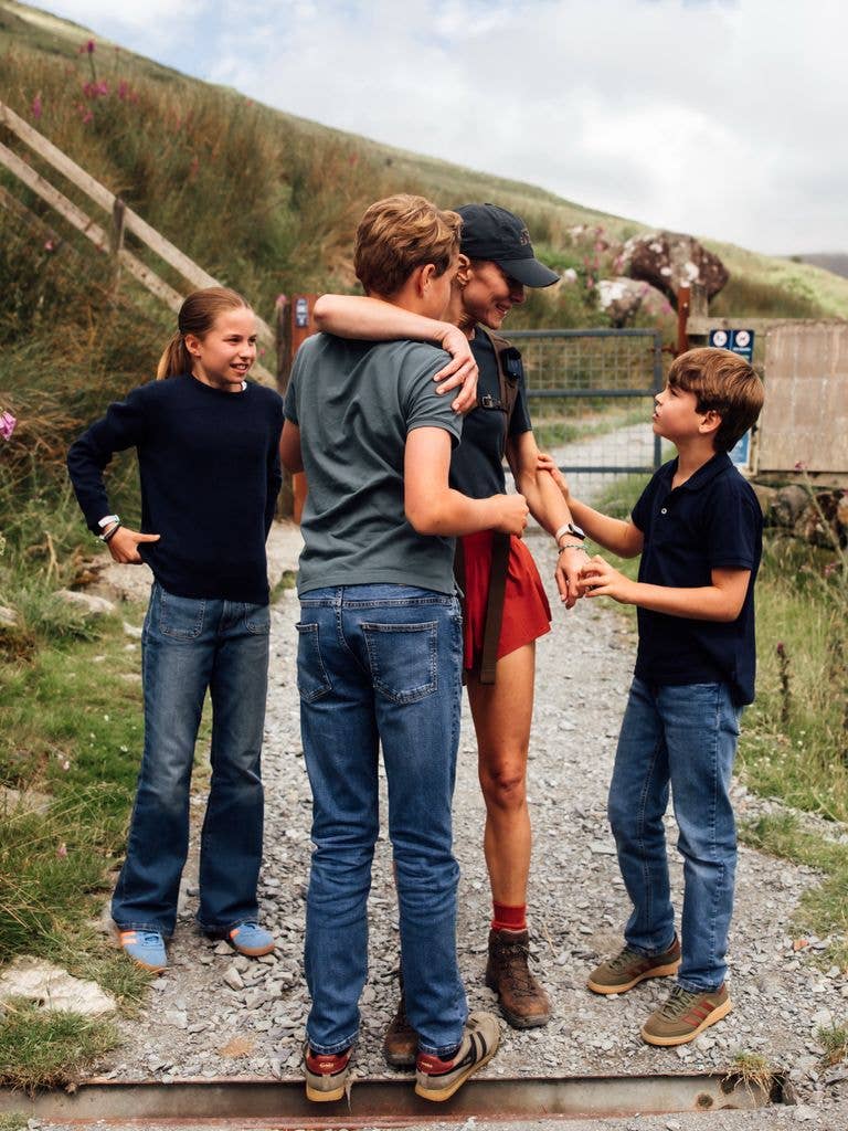 Kate Middleton greets her kids Charlotte, Louis and George after completing the National Three Peaks Challenge