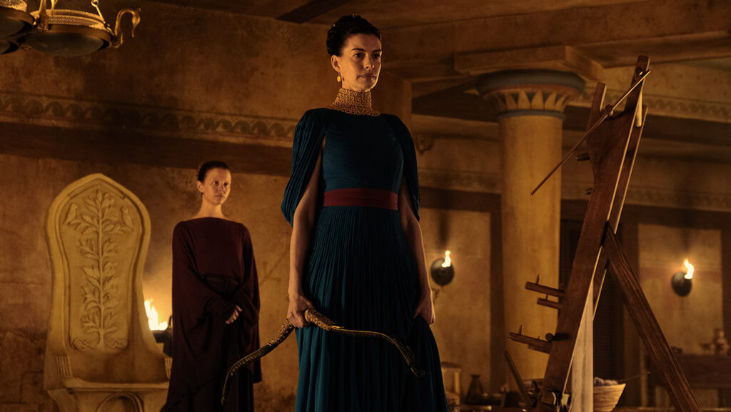 L to R: Mia Goth is Melantho and Anne Hathaway is Penelope in The Odyssey