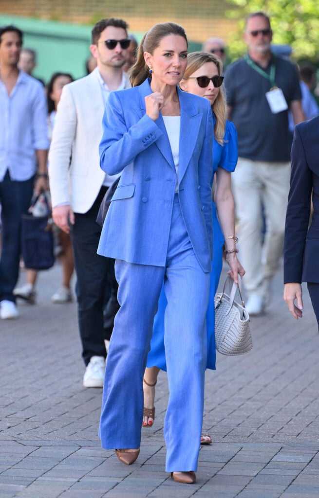 Catherine, Princess of Wales smiles as she attends day four of the 2026 Wimbledon Tennis Championships blue Gabriela Hearst suit.
