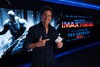 Tom Cruise shows off his movie ticket stub for a screening of 'The Odyssey.'