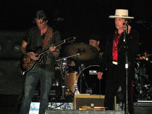 Musicians Charlie Sexton (L) and Bob Dylan perform at The Dell Diamond on August 4, 2009 in Round Rock, Texas. (Photo by Gary Miller/FilmMagic)