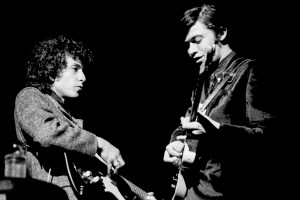 PHILADELPHIA, PA - FEBRUARY 24: An image of Bob Dylan (L) and Robbie Robertson (R) playing electric guitars during Dylan's 2nd set at the Academy of Music on February 24, 1966. (Photo by Charlie Steiner - Highway 67/Getty Images)
