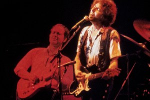 US poet and folk singer Bob Dylan (R), accompanied by US guitarist Steve Ripley, performs on the stage of the Johanneshov Ice Stadium in Stockholm, Sweden, on July 8, 1981. In the late 1970s, Bob Dylan produced a triptych of religious works with "Slow train coming" (1979), "Saved" (1980) and "Shot of love" (1981). (Photo by Johan HULTENHEIM / TT NEWS AGENCY / AFP) / Sweden OUT (Photo by JOHAN HULTENHEIM/TT NEWS AGENCY/AFP via Getty Images)