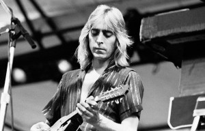 British Rock musician Mick Ronson (1946 - 1993), of the Ian Hunter Band, plays electric guitar as he performs during the Dr Pepper Music Festival, onstage at Central Park's Wollman Rink, New York, New York, July 11, 1980. (Photo by Gary Gershoff/Getty Images)