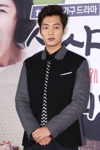 This photo taken on November 25, 2013 shows South Korean actor Yoon Doo-Joon attending new drama "Let's Eat" production announcement in Seoul. REPUBLIC OF KOREA OUT JAPAN OUT AFP PHOTO/STARNEWS (Photo credit should read Starnews/AFP via Getty Images)