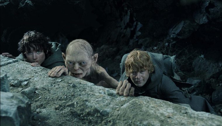 " Frodo" ( Elijah Wood), "Gollum" ( Andy Serkis), and Sam ( Sean Astin) take cover as they plot to enter Mt. Doom in New Line Cinemas epic film, The Lord of the Rings: The Return of the King. (AP Photo /New Line Productions)