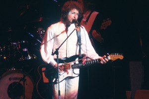 1978: Bob Dylan plays a Fender Stratocaster electric guitar as he performs onstage in 1978. (Photo by Michael Ochs Archives/Getty Images)