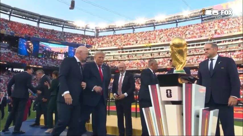 USA president Donald Trump, shows reluctance to leave the stage and has to be ushered away before Spain can lift the FIFA World Cup trophy.