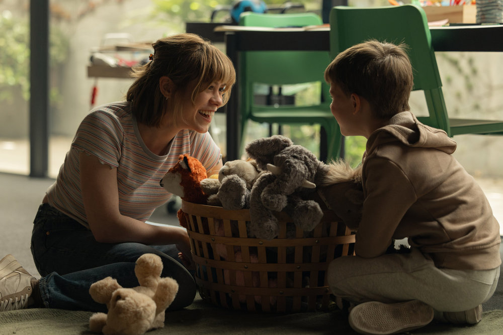 Sophia Lillis as Carrie Finch with Tayden Jax Ryan as Jacob Kaminski.
