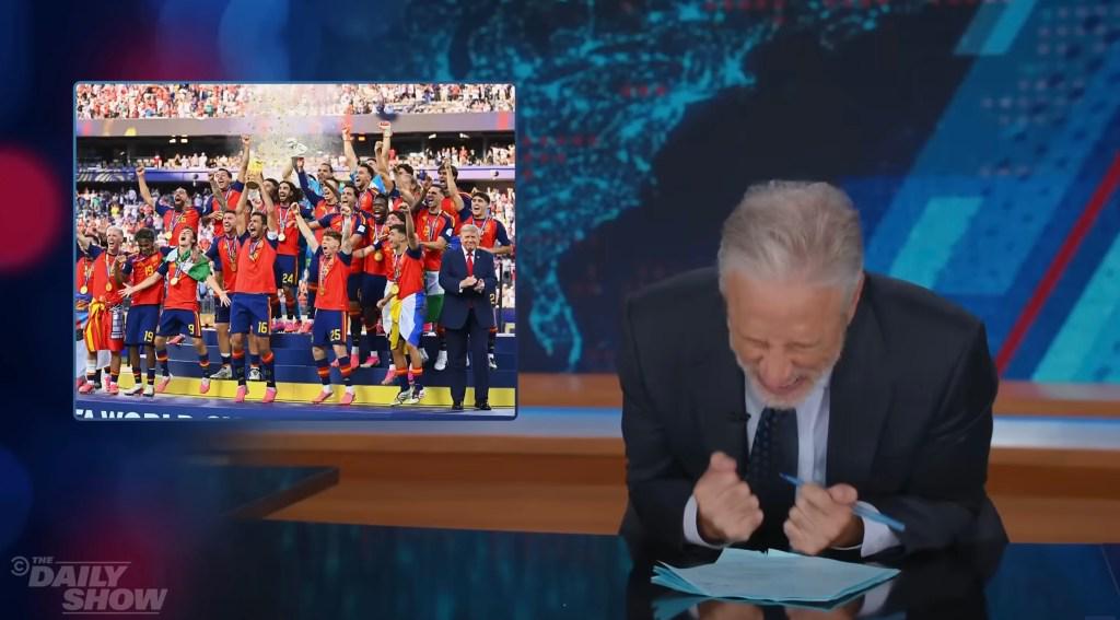 Jon Stewart Cringes At Trump’s World Cup Photobomb: “What The F*ck Are You Doing On The Stage?”