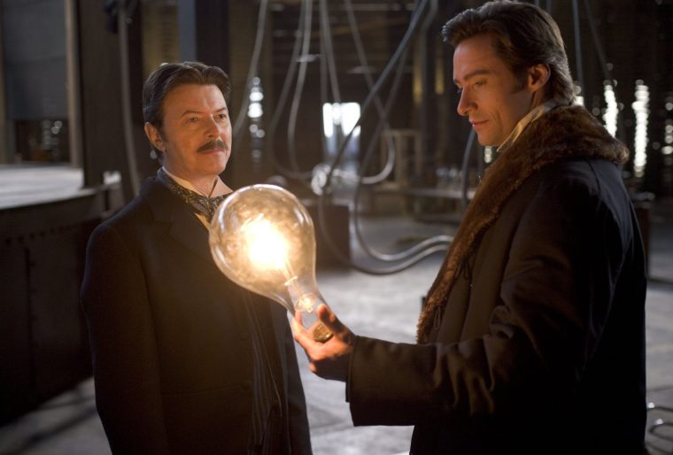 Film: The Prestige (2006) Pictured: David Bowie (Nikola Tesla) and Hugh Jackman (Robert Angier) in Warner Bros. Pictures and Touchstone Pictures The Prestige, directed by Christopher Nolan. The film stars Hugh Jackman, Christian Bale, Michael Caine and Scarlett Johansson.
