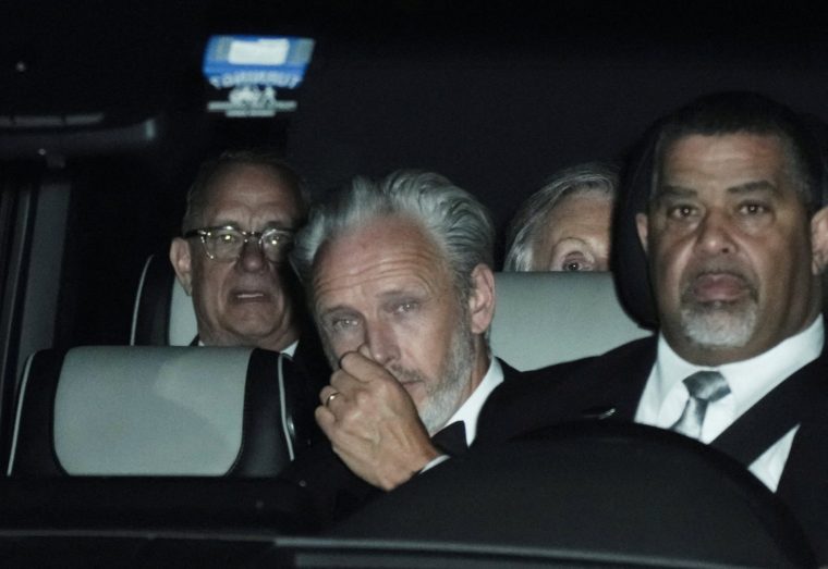 Tom Hanks and Paul McCartney depart Madison Square Garden, the venue for the wedding celebrations of singer Taylor Swift and National Football League (NFL) player Travis Kelce, in New York, U.S., July 4, 2026. REUTERS/Bing Guan