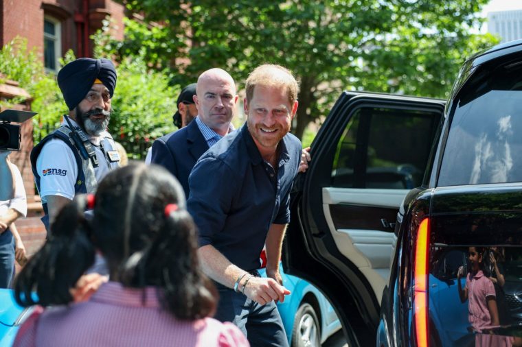 Britain's Prince Harry greets a child as he leaves the Birmingham Children's Hospital after celebrating the 20th anniversary of the first WellChild Nurse programme, in Birmingham, Britain, July 9, 2026. REUTERS/Isabel Infantes
