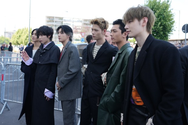 ENHYPEN arrives for Prada's Spring/Summer 2027 men's collection presented in Milan. The group will make a special appearance at Comic-Con. (AP Photo/Antonio Calanni)