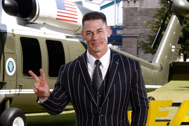 John Cena poses for photographers upon arrival at the photo call for the film 'Heads of State.' He'll be at Comic-Con to discuss the series "Peacemaker." (Photo by Millie Turner/Invision/AP)
