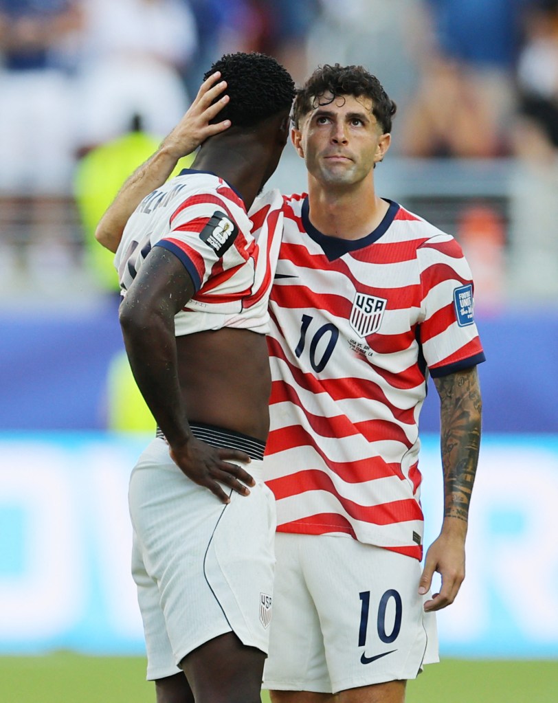 Christian Pulisic of the USMNT embracing a teammate during the FIFA World Cup 2026 Round of 32 match against Bosnia and Herzegovina.