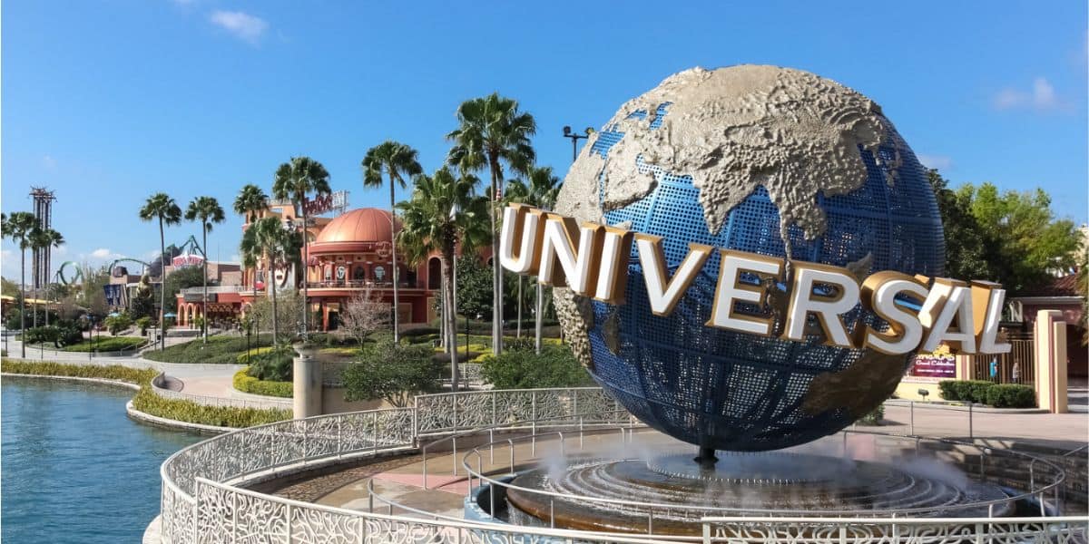 Universal Orlando's iconic spinning globe with Hard Rock Cafe and Islands of Adventure in the distance. Universal Orlando early closures April