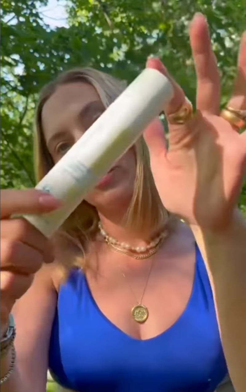 Scarlett Johansson displays her Hydrasheer Sunscreen in a video posted on The Outset’s Instagram.