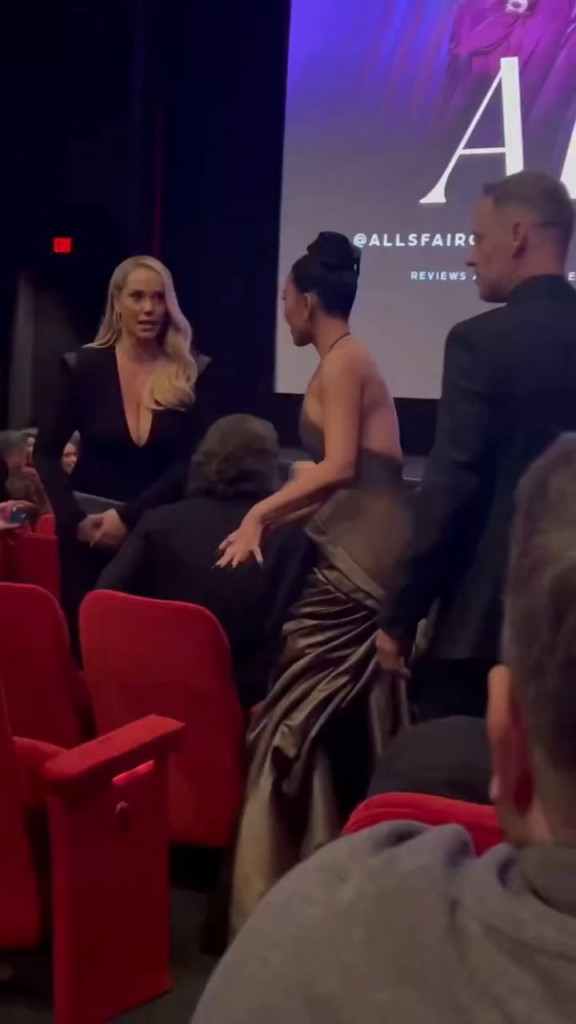 Kim Kardashian attempts to sit down with a tight figure-hugging dress