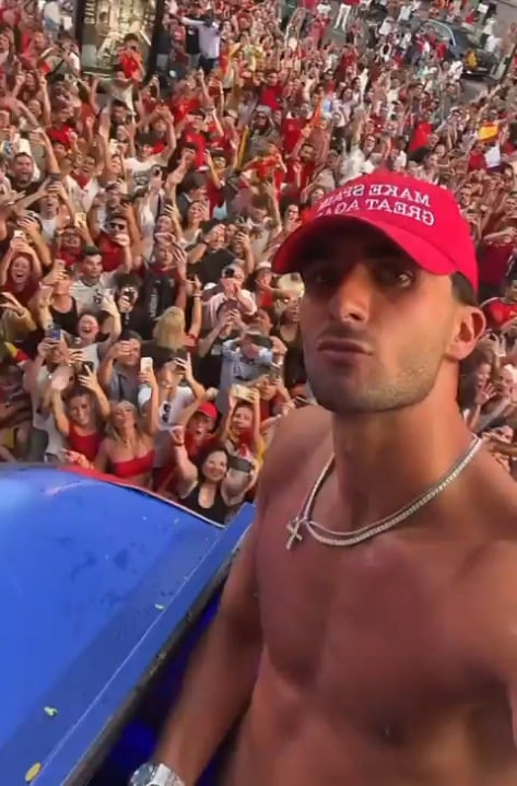 Ferran Torres who scored the winning goal in the world cup final with his 'Make Spain Great Again' cap during the victory celebrations in Madrid