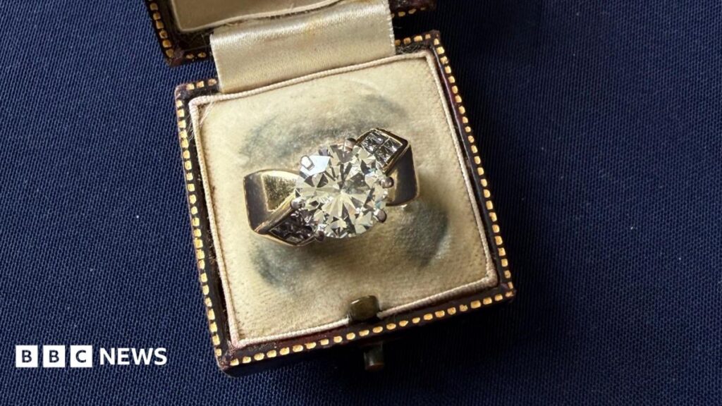 Diamond ring bought for £5 at car boot sale valued at £15k A diamond ring in an open vintage brown ring box on a dark blue background