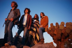 March 1972 --- The rock band The Eagles rest in a desert valley. The Eagles were the most popular band of the seventies and their reunion tour in the nineties was also very successful. L-R: Bernie Leadon, Don Henley, Glenn Frey, and Randy Meisner. (Photo by Henry Diltz/Corbis via Getty Images)