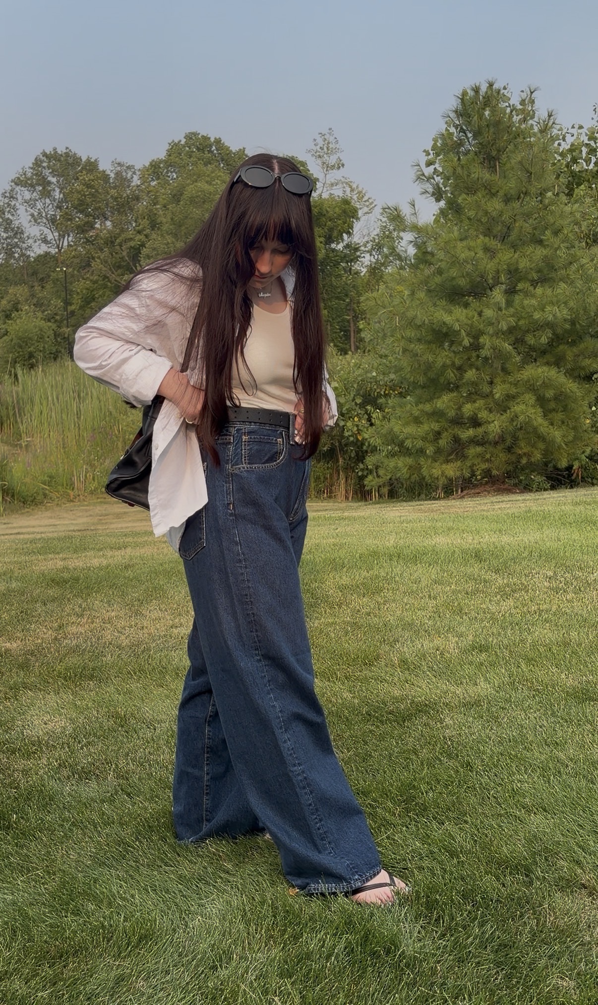 Meguire Hennes poses in dark-wash jeans from Hailey Bieber's denim Gap collection