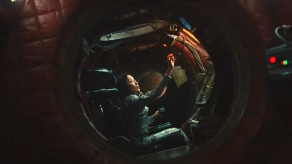 woman in cockpit of a small futuristic aircraft