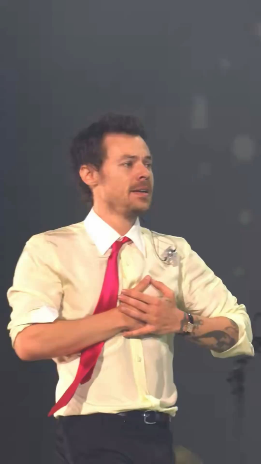 Harry Styles getting emotional on stage at the end of his record-breaking 11th show at Wembley Stadium in London