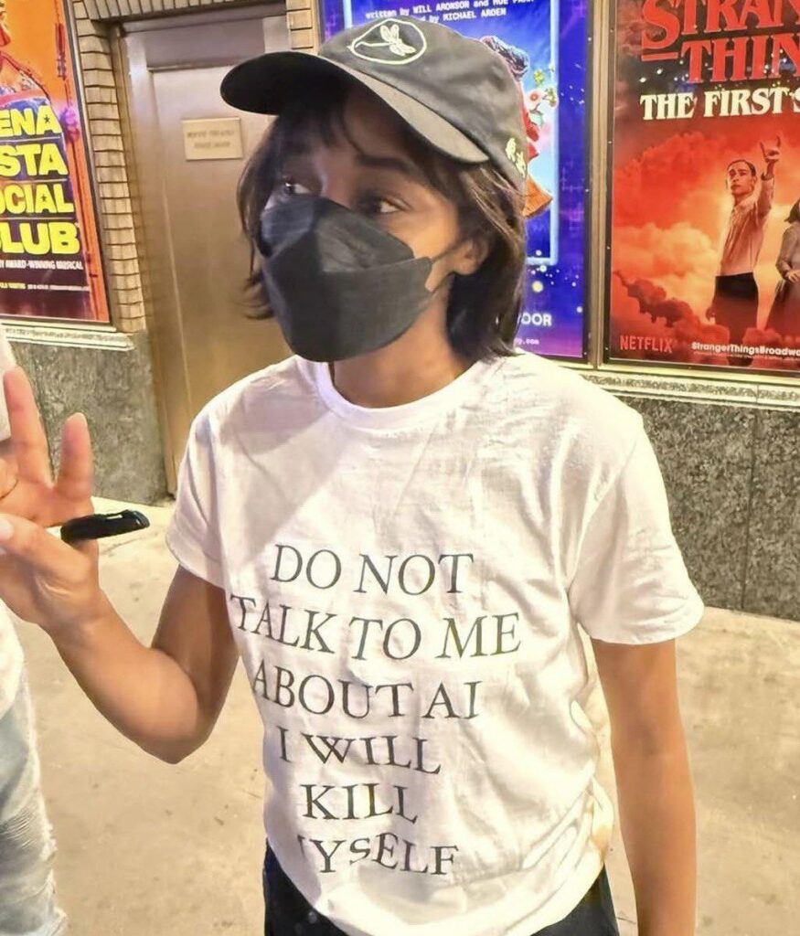 Ayo Edebiri wearing a “Do Not Talk To Me About AI, I Will Kill Myself” shirt.