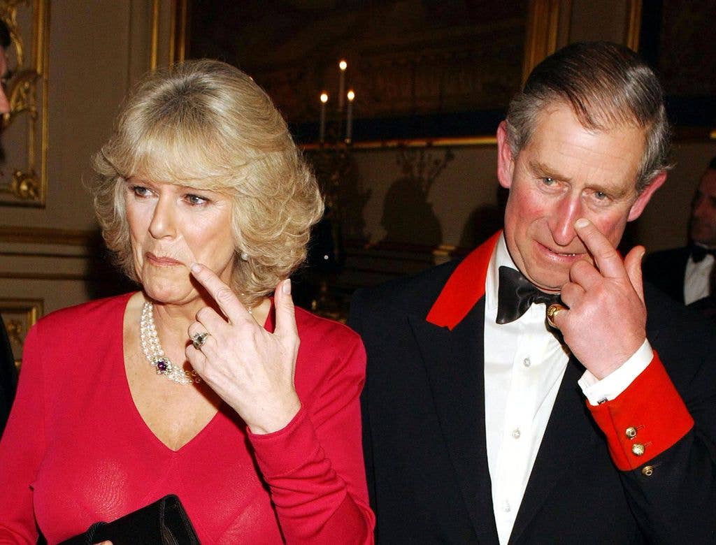 Queen Camilla wearing a red dress and her new engagement ring