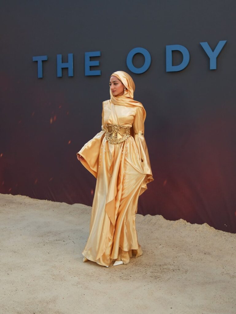 British journalist, Zainab Jiwa, wearing a bespoke gown by Harriet Christelow paired with a corset by Arma Medusa to the London premiere of The Odyssey.