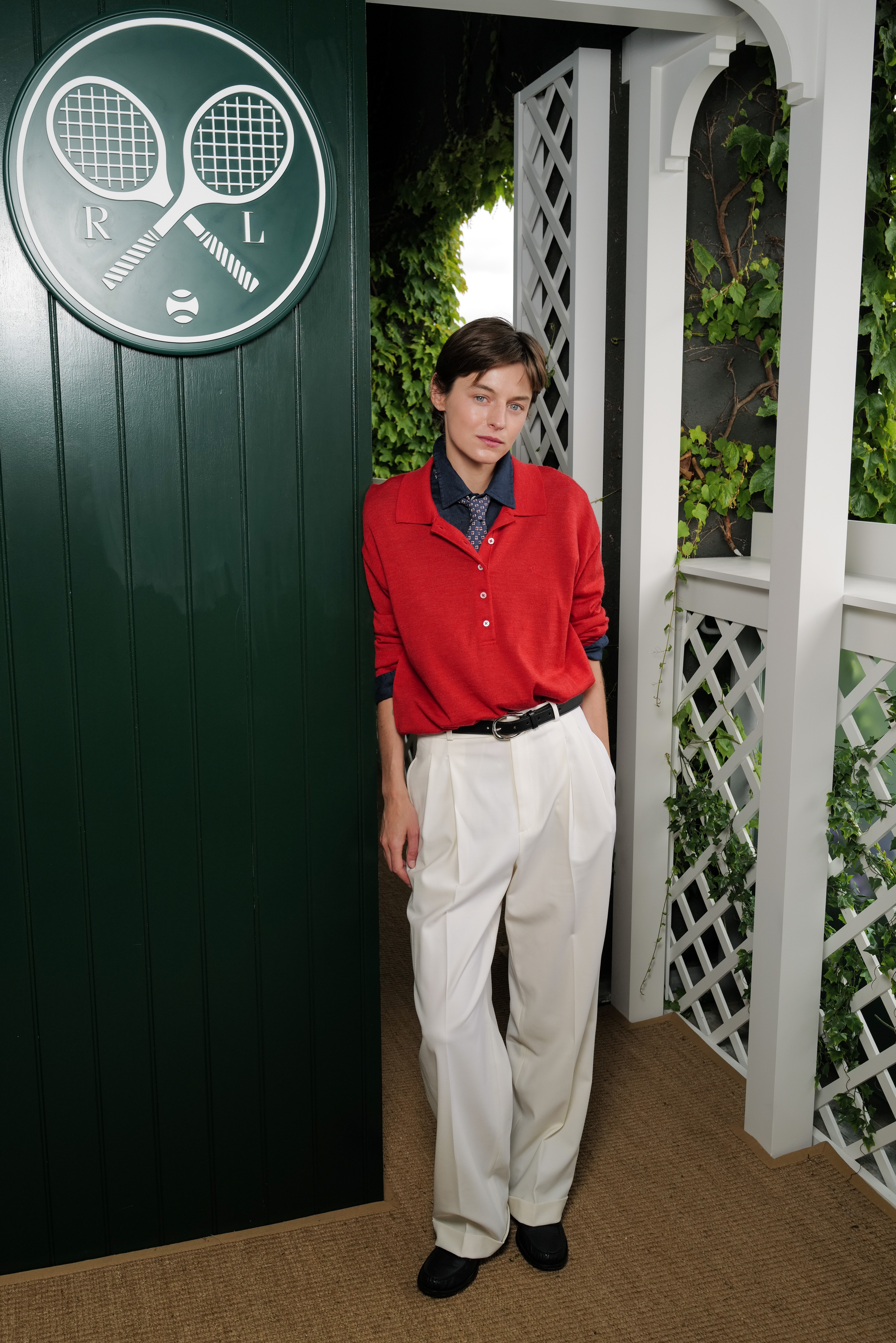 Emma Corrin attended Wimbledon 2026 in a red polo shirt and white trousers