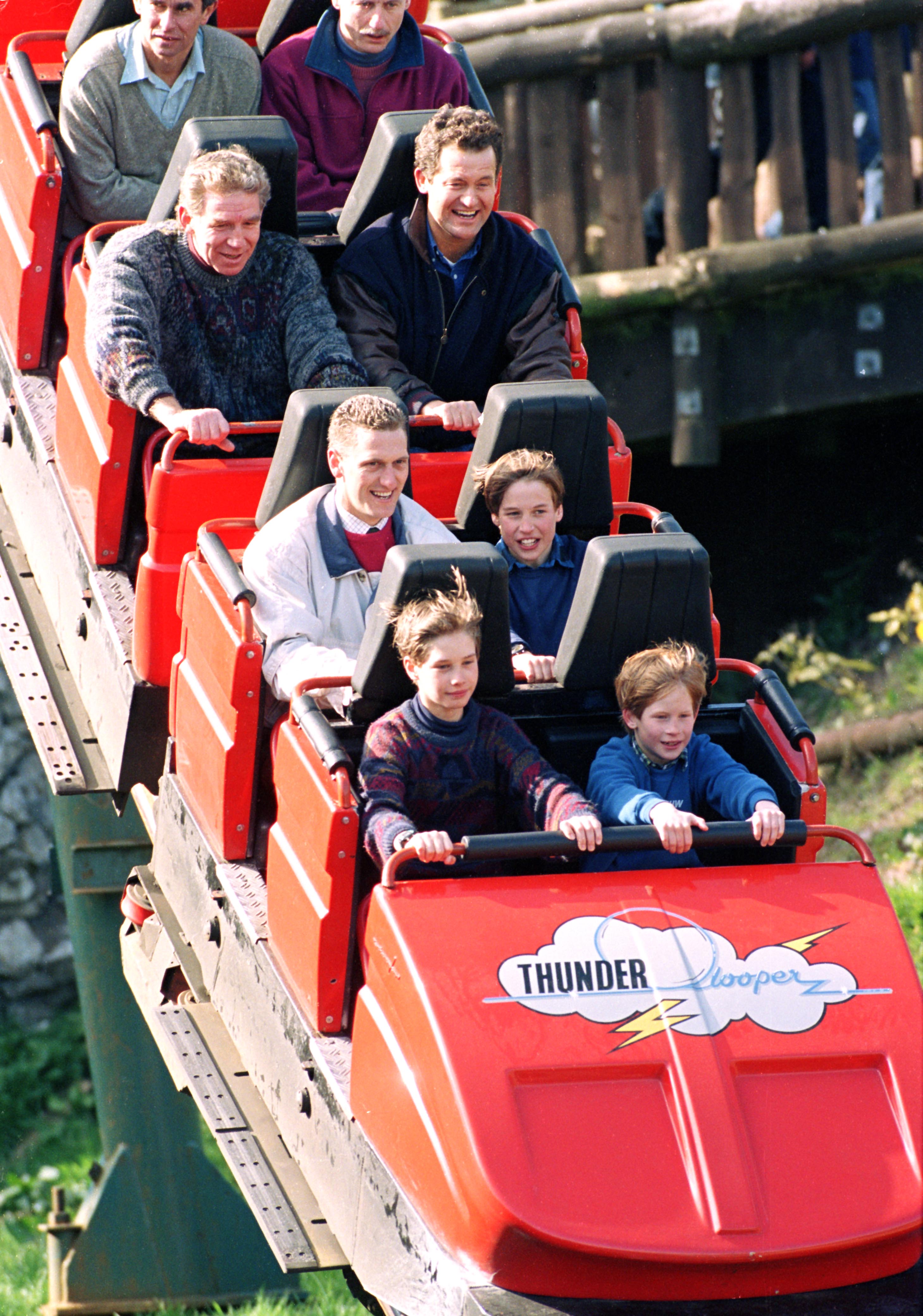 Paul Burrell, Prince Harry, Prince William and others riding a roller coaster