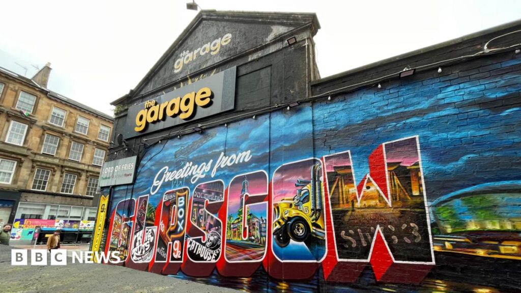 Historic Glasgow nightclub The Garage put up for sale An outside shot of the Garage in Glasgow with a mural reading 'Greetings from Glasgow' on the side.