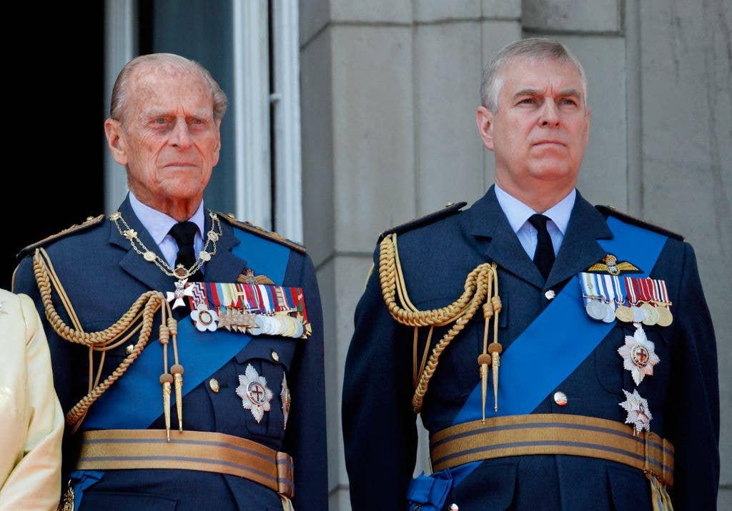 Prince Philip, Duke of Edinburgh and Prince Andrew, Duke of York watch a flypast of Spitfire & Hurricane aircraft from the balcony of Buckingham Palace to commemorate the 75th Anniversary of The Battle of Britain on July 10, 2015 in London, England.