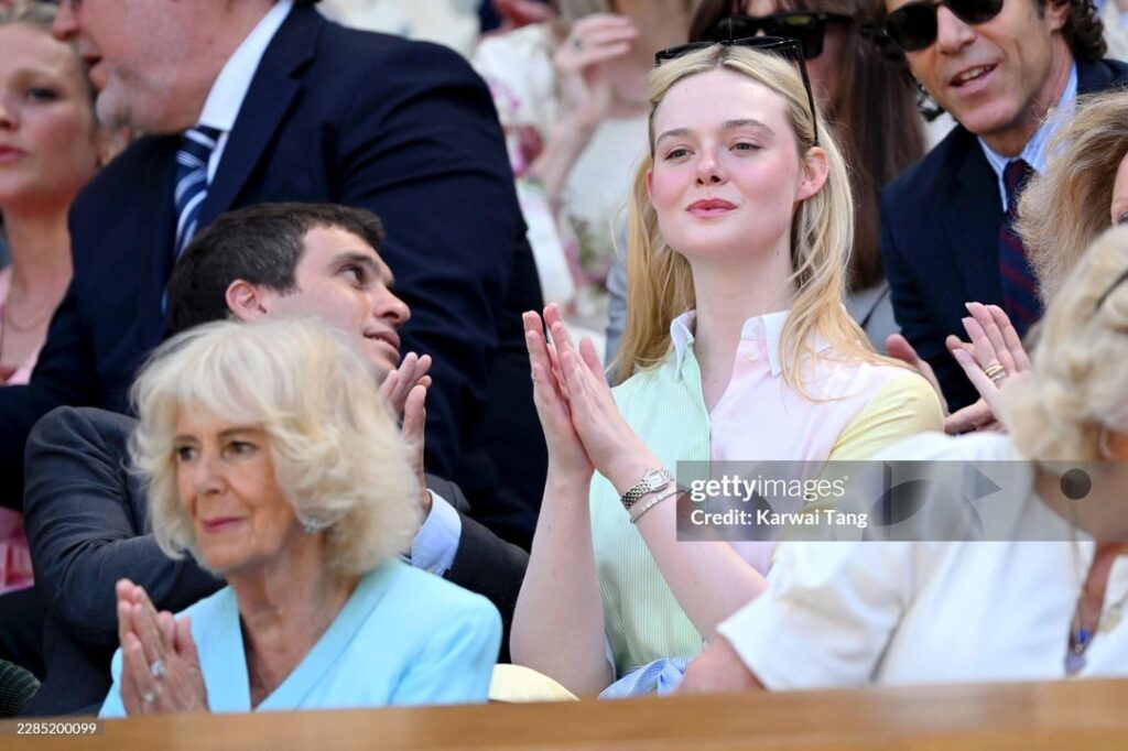 Elle Fanning sits behind Queen Camilla in the Royal Box at Wimbledon quarter finals
